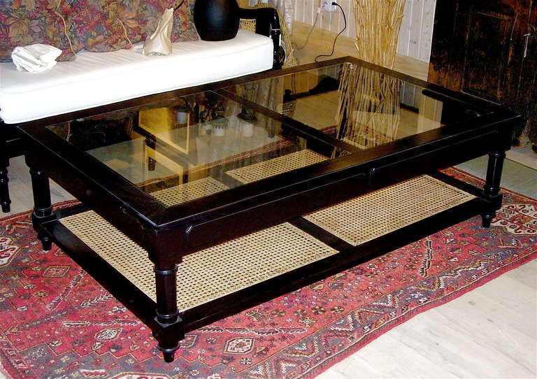 Anglo Indian Style Ebonized Wood, Glass And Cane Coffee Table.