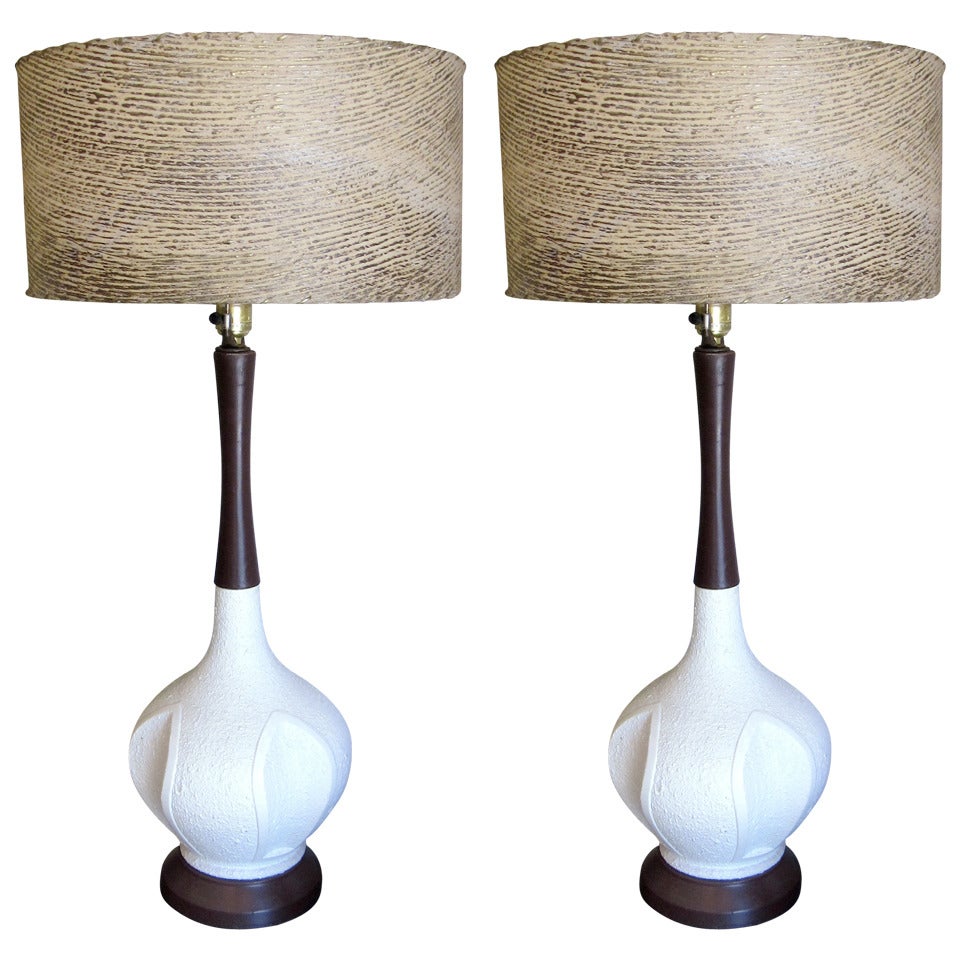 One pair of white ceramic textural mid century lamps with period shades
