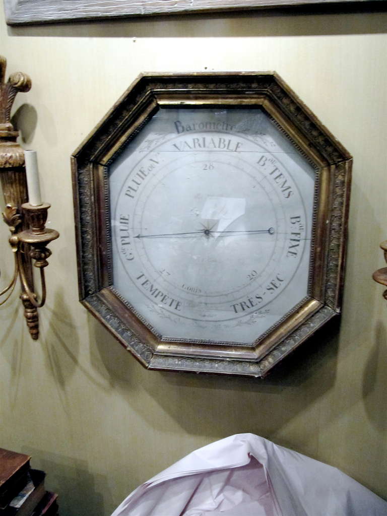18th century French barometer in giltwood frame.