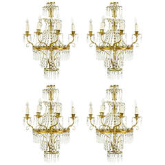 Suite of Four Gilt Metal and Crystal Four-Light Sconces