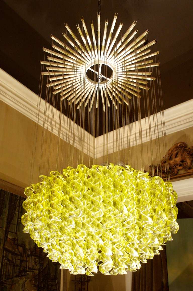Venetian blown-glass pendant light fixture. Electrical piece marked Milan. Each handblown spiral glass piece is suspended from a thin chain with a three-cluster bulb fixture that hangs from within. Note this is a single not a set.