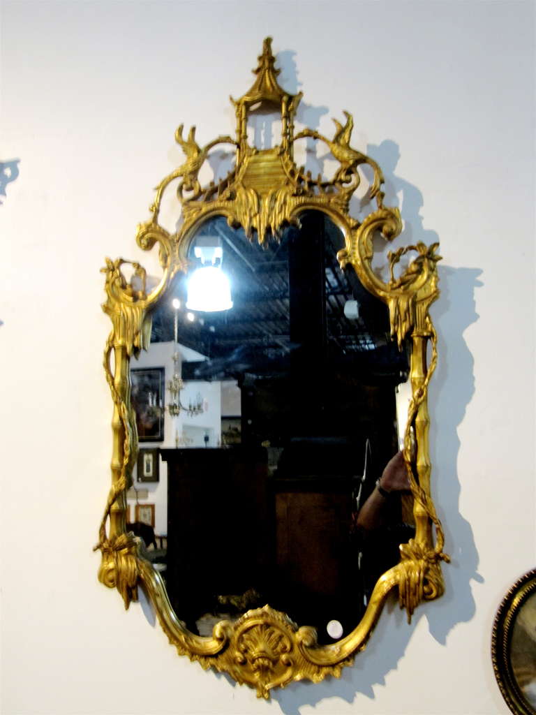 Chinese Chippendale Style Gilt Wood Mirror, Having Pagoda Form Crest Over The Cartouche Form Plate Within A Foliate Decorated Frame.