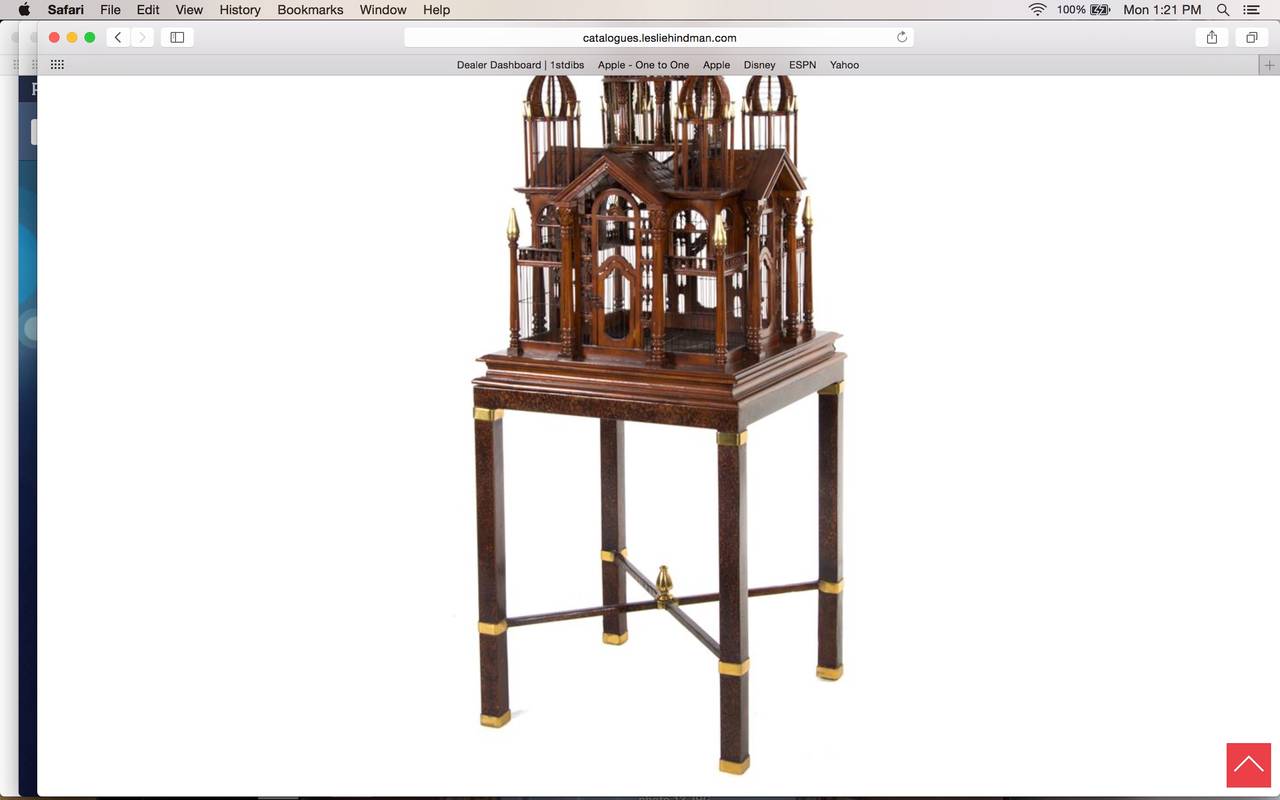 Spectacular monumental English mahogany bird cage on stand with brass banding and finials, strong architectural details.  Great accent piece that is shown in our library showroom.