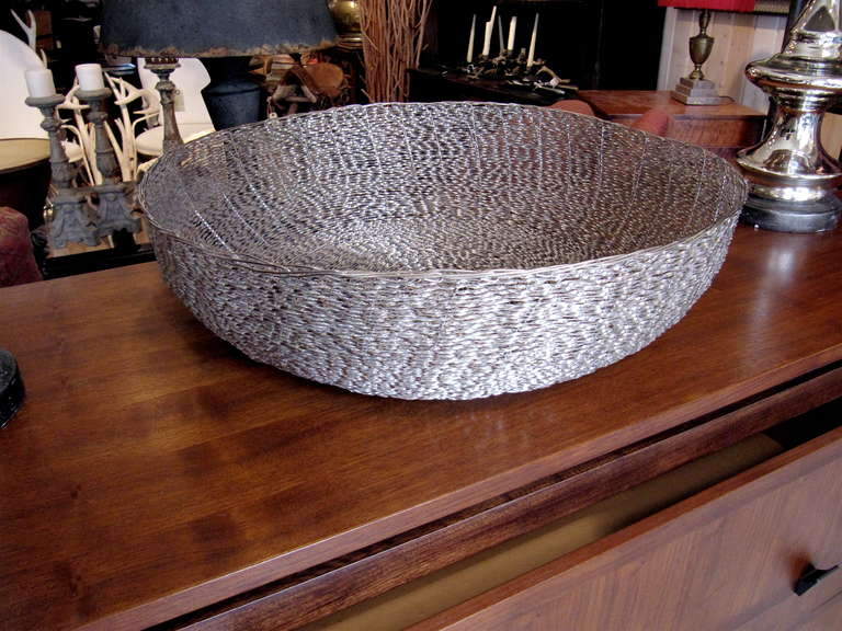 Monumental woven metal center or accent bowl, very textural.