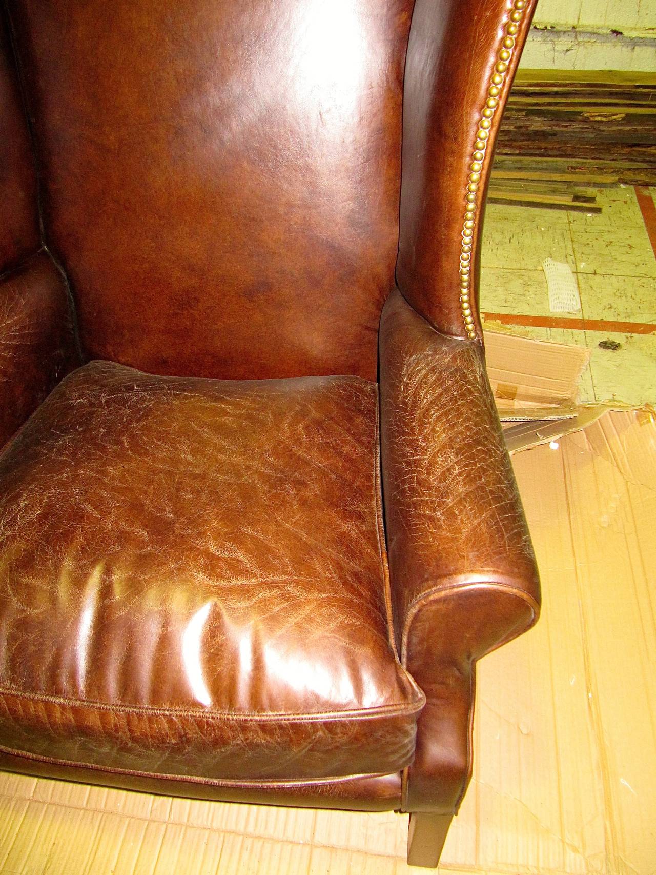 distressed leather wingback chair