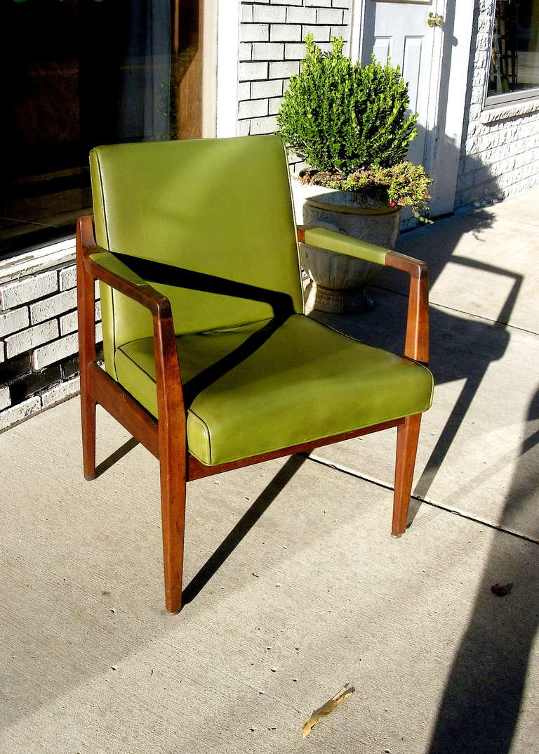 One pair of Mid-Century leather and solid mahogany armchairs by Marble Chair Company. Very solidly built and leather is in very good condition.