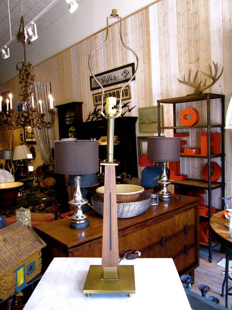 Chic pair of teak and bronze Mid-Century table lamps.
