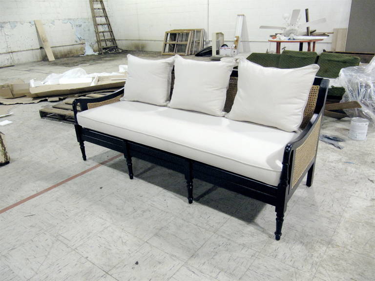 Handsome Anglo Indian Ebonized Three Seat Sofa/Sette With White Cushions,  Caining on back and sides in pristine condition.  Also have one pair of matching arm chairs.