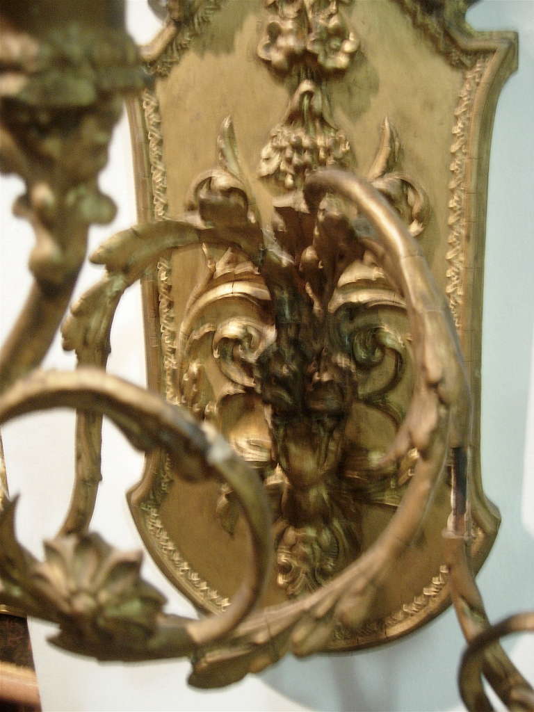 19th Century Pair of Continental Giltwood Three-Arm Sconces For Sale