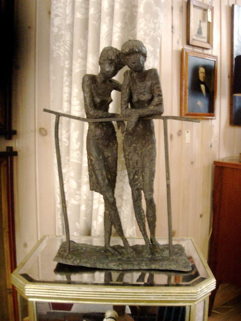 Striking bronze sculpture of two ladies in the manner of Alberto Giacometti.