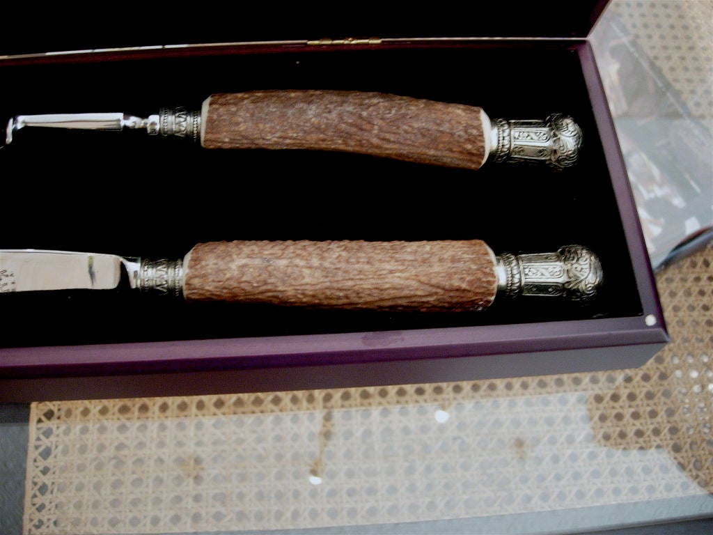 Handsome English style pewter and antler mounted carving set.