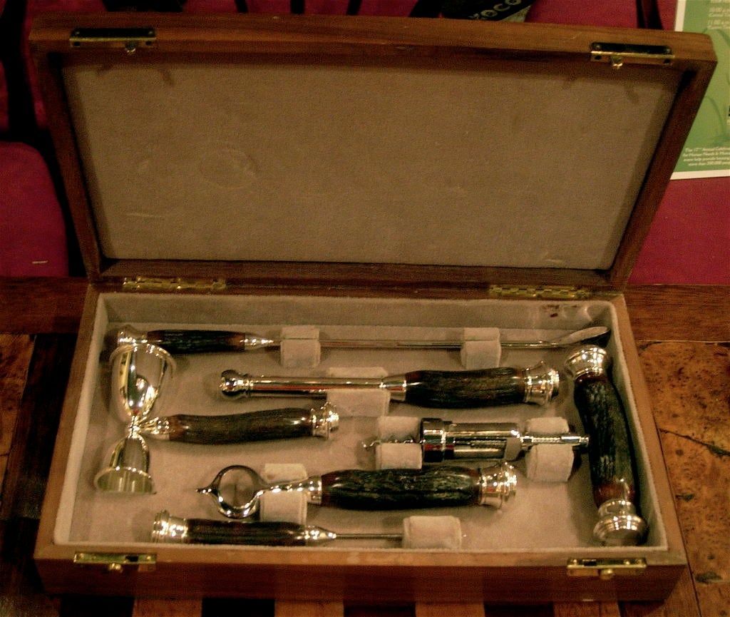 EXCEPTIONAL JOHN HASSELBRING SIX PIECE STERLING SILVER, HORN, AND CHROME BAR SET. IN CUSTOM FITTED CASE