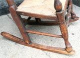 19th century or earlier.

Very charming English childs rocking chair with rush seat. Very nice old finish with good color and patination. Rush seat in very good condition.  Feel free to call or email with further questions.