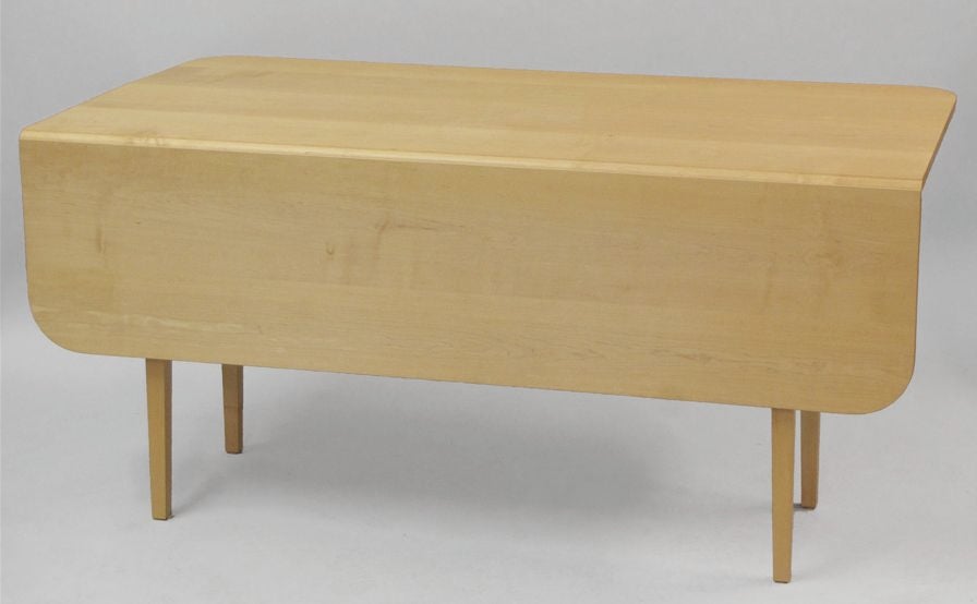 THOMAS MOSER MAPLE DROP-LEAF TABLE.<br />
Signed below top and dated 2001