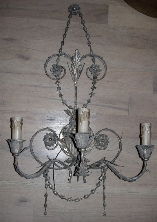Twelve French tole three-light wall sconces With Silver Leaf Finish. Newly Wired So Ready For Installation. Priced per sconce.