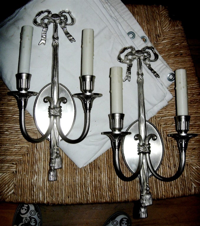 One pair of Louis XV style two-arm wall sconces with silver finish, very elegant. Newly wired so ready for installation.