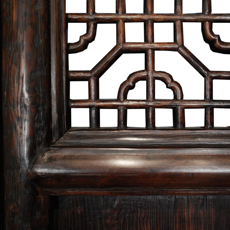 A set of four 19th century Chinese elmwood courtyard panels with lattice work tops.

Pagoda Red Collection #:  K061

Keywords:  Doors, closet, panels, screen, folding