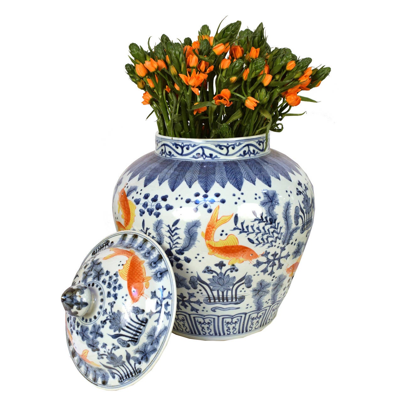 A pair of blue and white jars from Beijing, China with lids and golden yellow fish amongst a floral and vine motif.

Pagoda Red Collection # BJCC026