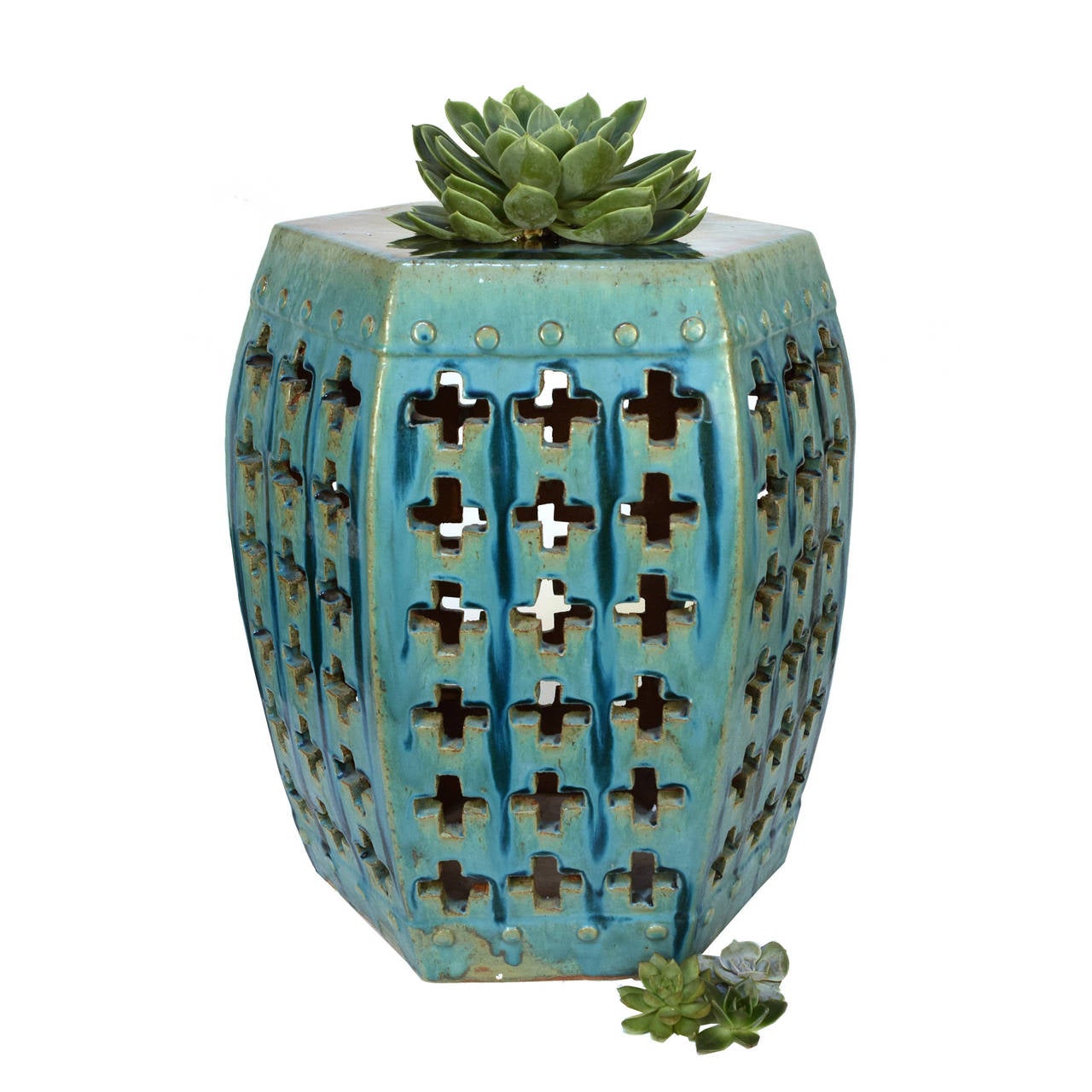 A green glazed garden stool from Beijing, China with a modern geometric pattern.

 