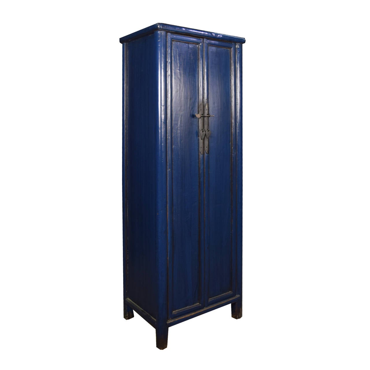 A c.1900 lapis blue narrow cabinet from Hebei Province, China with two doors that open to three shelves and two drawers.

Pagoda Red Collection # BJDD037