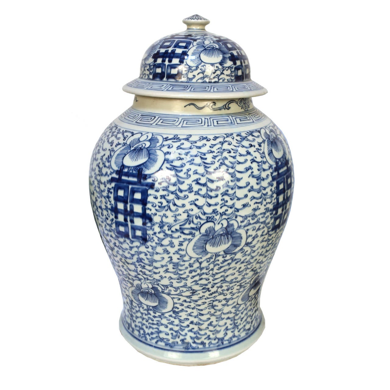 A blue and white jar from Beijing, China featuring the double happiness character and a twisting vine pattern on the jar and lid. 

 