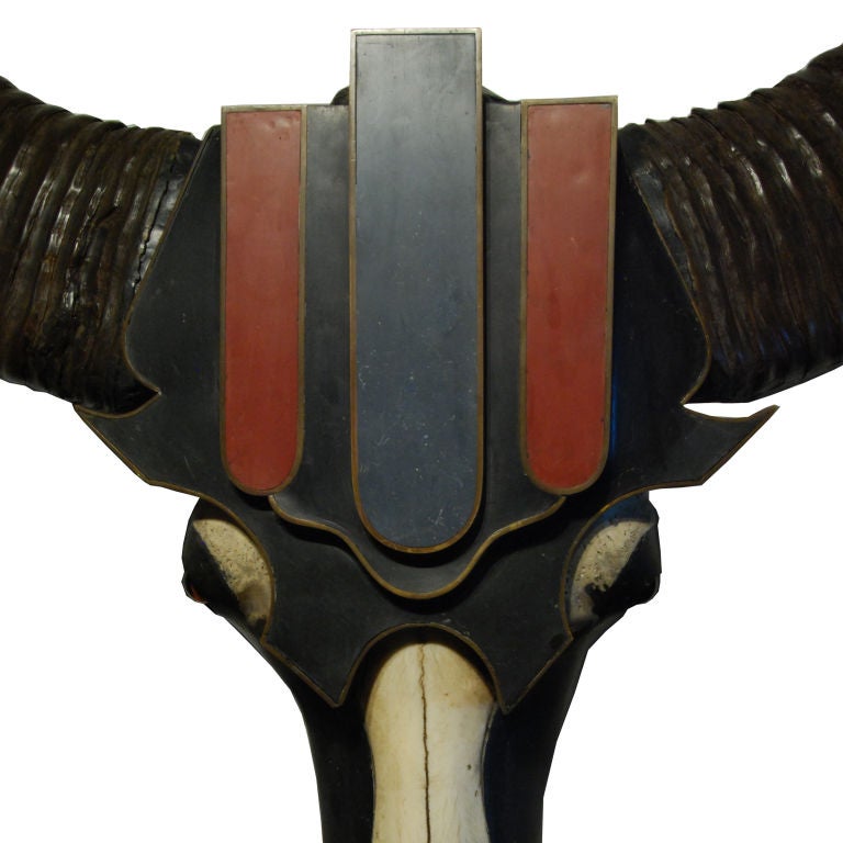 A wonderful French Art Deco Sculpture with water buffalo skull mounted with resin inlaid bronze bezel on forehead, hammered aluminum caps on bottom of skull, larger-than-life horns and glass eyes.<br />
<br />
Pagoda Red Collection #:  CHAS001<br