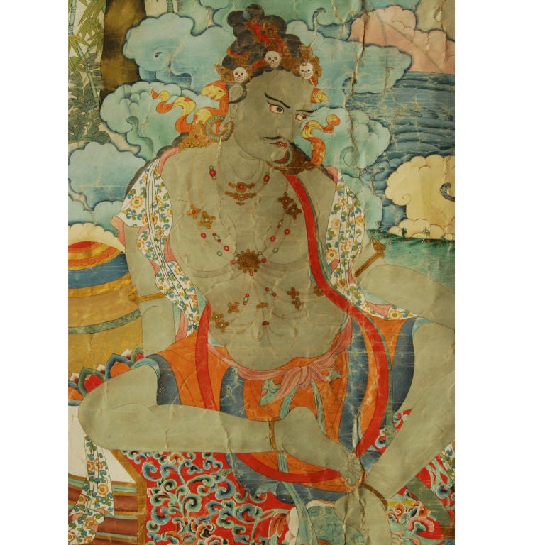 An 18th century Tibetan thangka depicting the siddha Luipa, as recognized by the fish in his left hand, with wonderful brocade border and silver caps on bottom scroll.<br />
<br />
Pagoda Red Collection #:  BTE001<br />
<br />
<br />
Keywords: 