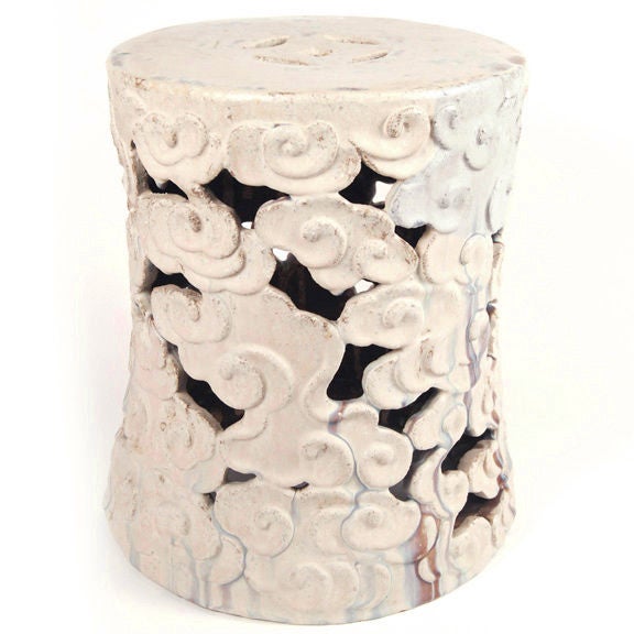 A cream glazed swirling cloud motif ceramic garden stool with prosperity coin on top.<br />
<br />
Pagoda Red Collection #:  Y020