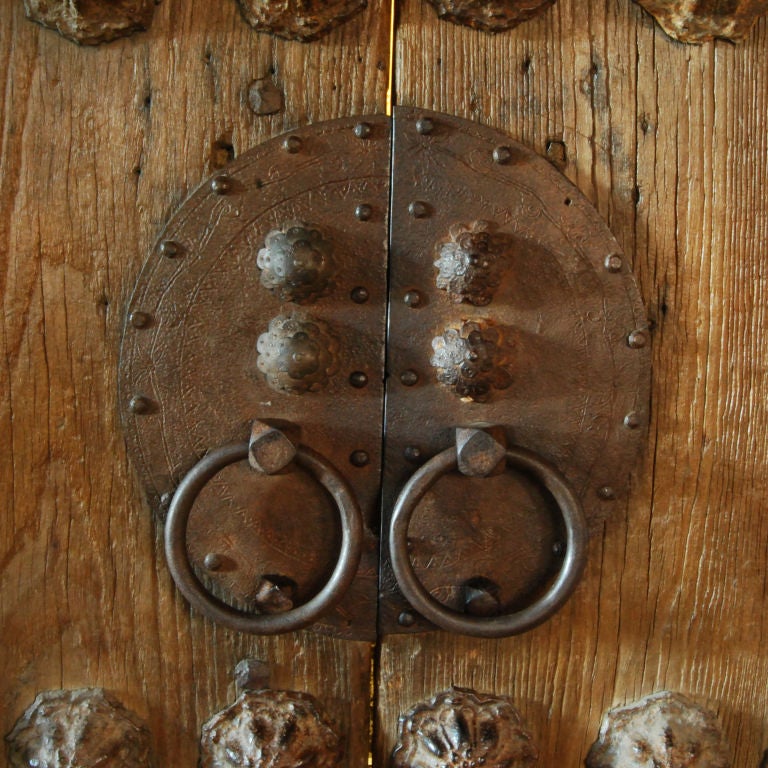 A pair of late Ming, Yuan style doors with massive iron studs and well worn patina.<br />
<br />
Pagoda Red Collection #:  K145<br />
<br />
<br />
Keywords:  Doors, barn doors, panels, closet, cabinet, screen, divider