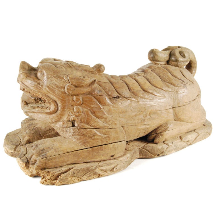 A pair of late Ming carved elmwood Fu dogs with carved manes, up-curled tails and open mouths.  <br />
<br />
Pagoda Red Collection #:  PHA028<br />
<br />
<br />
Keywords:  Ming, China, Chinese, statue, sculpture, Fu dogs, Foo dogs, wood