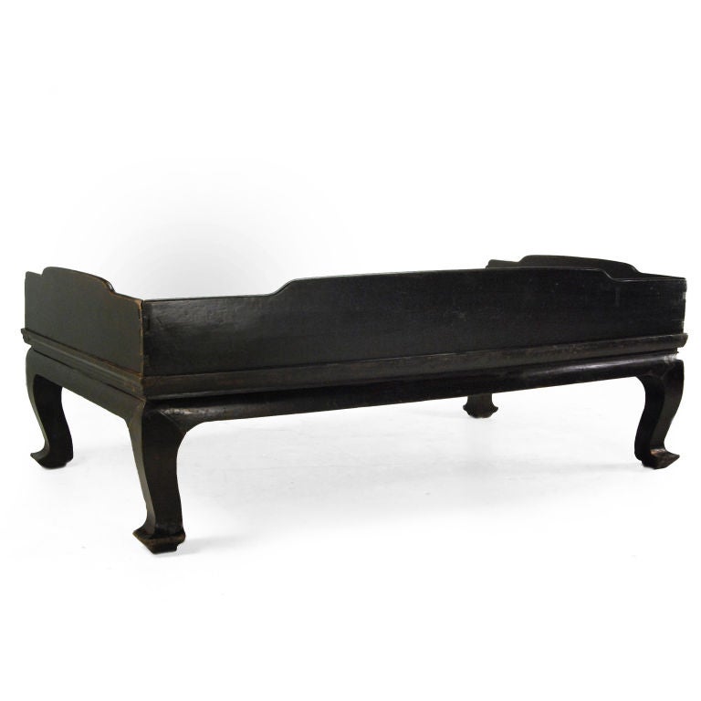 A 19th century Chinese elmwood Luohan daybed with simple side rails, a caned seat and gently curved legs ending in horse-hoof feet.<br />
<br />
Pagoda Red Collection #:  U138<br />
<br />
<br />
Keywords:  Bed, daybed, sofa, settee, chaise,
