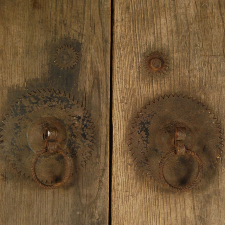 A pair of 19th century Chinese elmwood courtyard doors with large iron hardware including a latch on the back.<br />
<br />
Pagoda Red Collection #:  W091