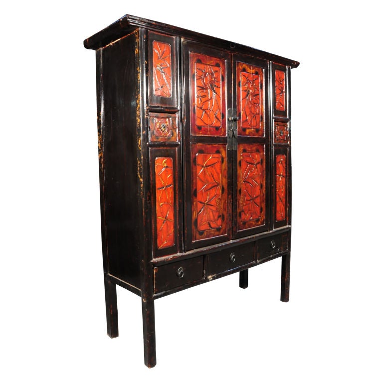 A Painted two door cabinet from the Fujian Province in China, c. 1850. The cabinet features two doors that houses two shelves and two drawers.

Pagoda Red Collection # CAG005