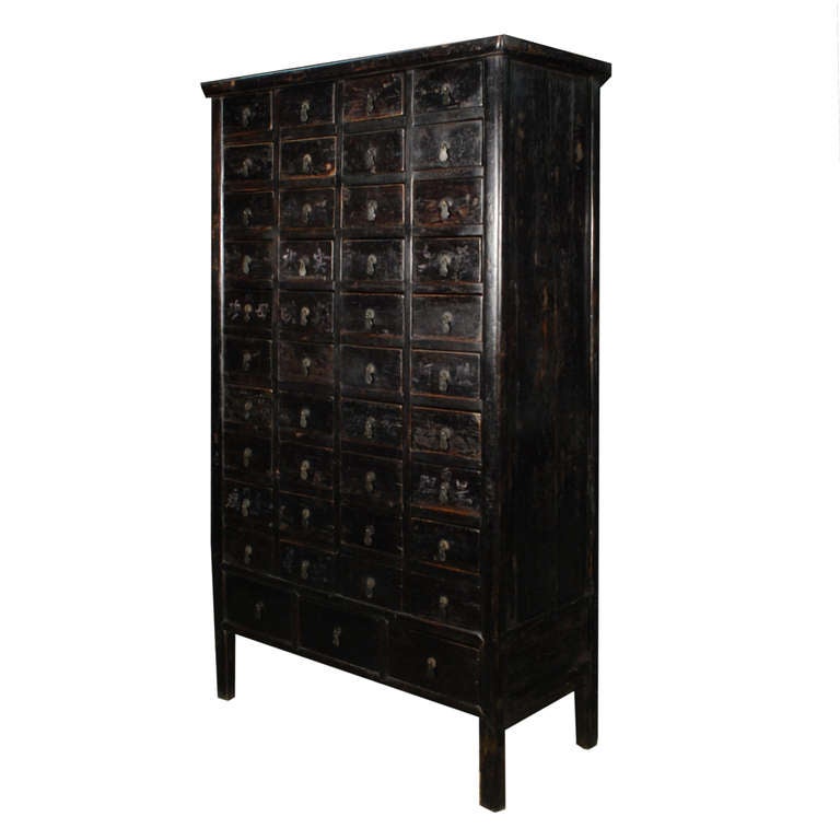 A tall apothecary cabinet from Hebei Province, China. This cabinet has forty-three drawers, all with multiple individual compartments. On many of the drawers you can still see the Chinese characters that labeled what was once inside.

Pagoda Red
