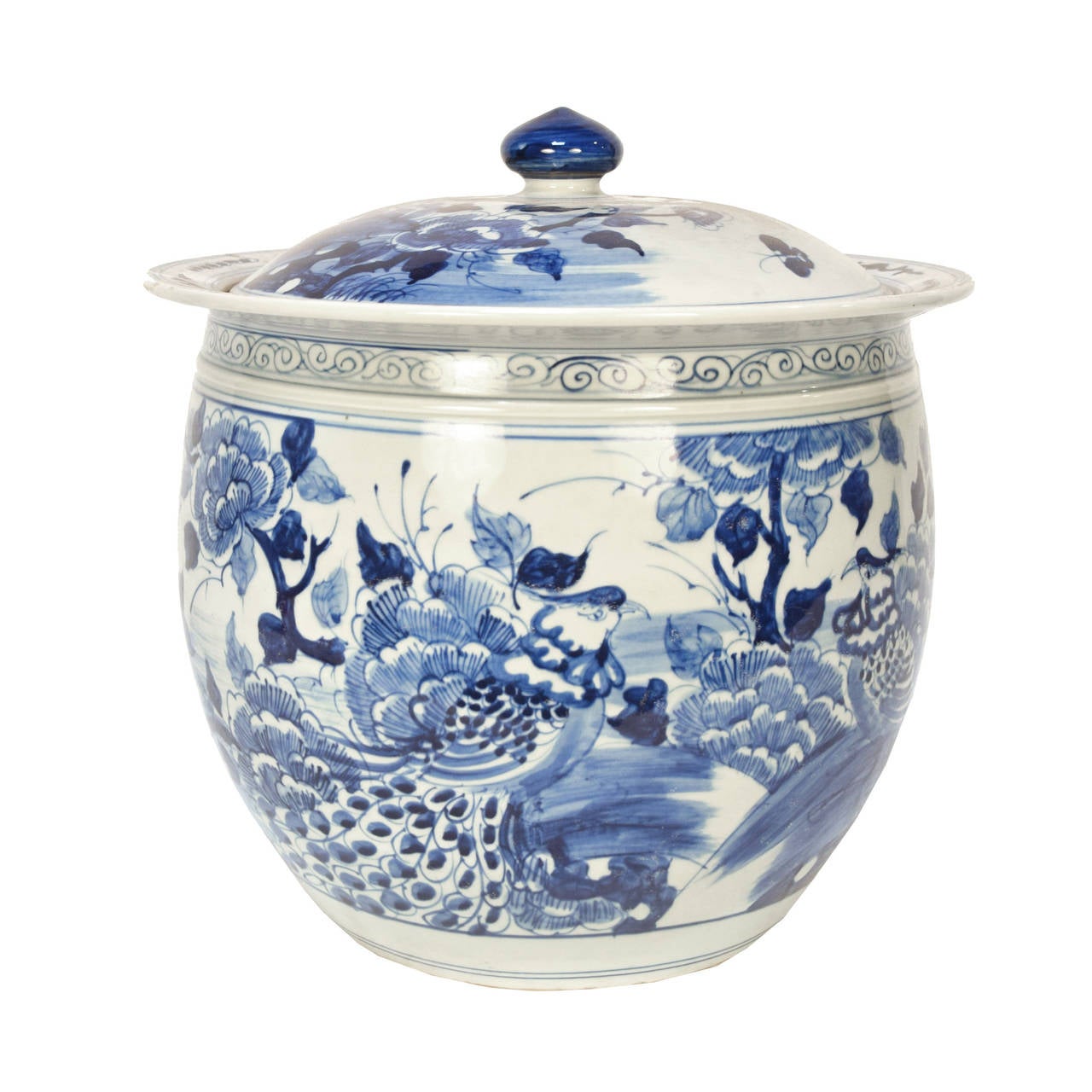 A blue and white ceramic jar with a lid from Beijing, China painted in a floral scene with phoenix.

         