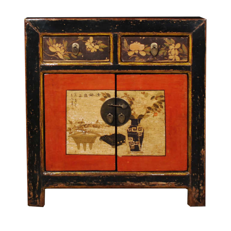 A charming pair of painted cabinets from Mongolia. These cabinets have  two doors and two drawers and were painted by Musho Ping.