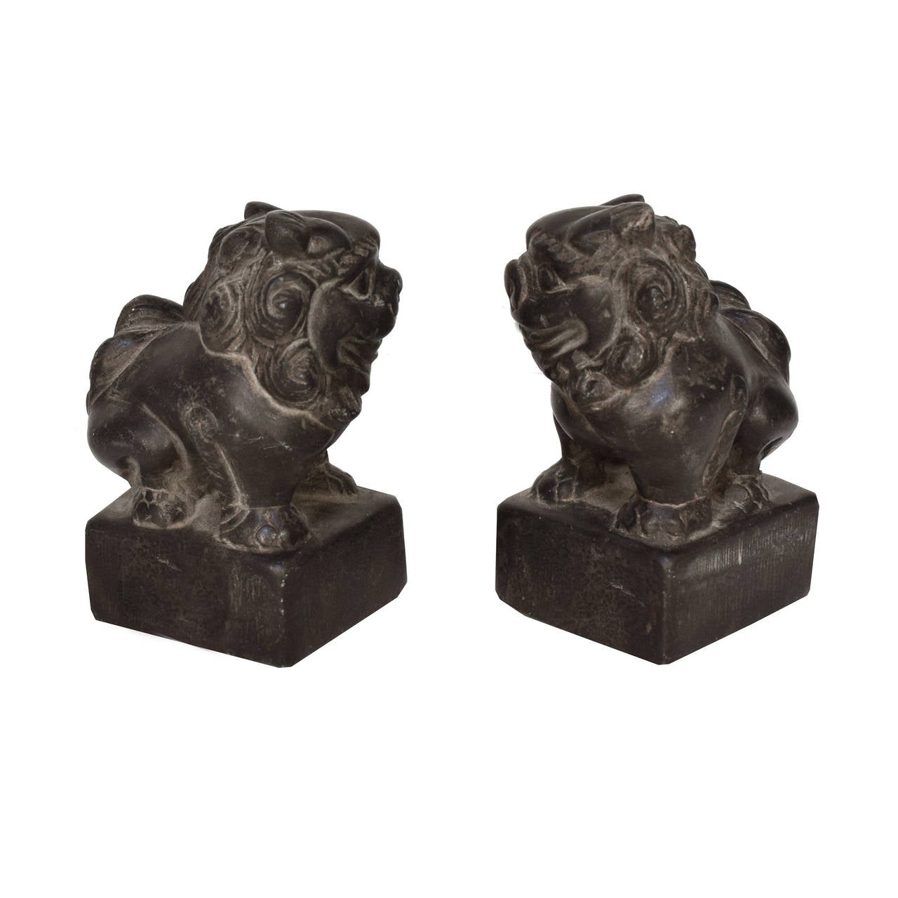A pair of petite fu dog charms from Northern China. These c. 1800 stone fu dogs are mirror images of each other and are a symbol of protection in China.
