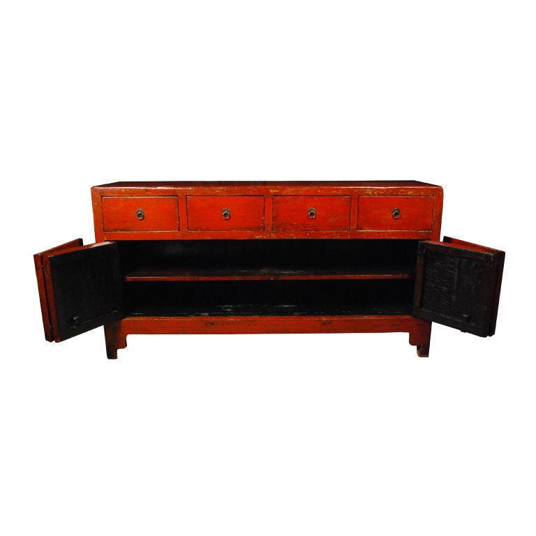 A 19th century Chinese red lacquer coffer with four drawers, two bi-folding doors and brass hardware.<br />
<br />
Pagoda Red Collection #:  CAH029<br />
<br />
<br />
Keywords:  Coffer, cabinet, chest of drawers, dresser, media, console table