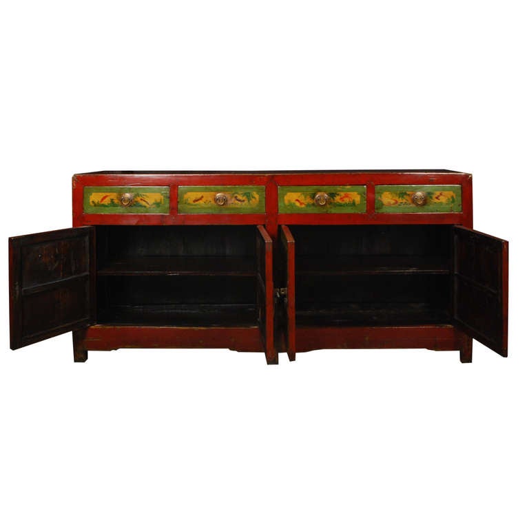 A four door four drawer coffer from Northern China, This coffer is painted with a landscape scene across the doors and fish and crabs across the drawers. The doors open to a large storage area with a shelf.

Pagoda Red Collection # BJC102