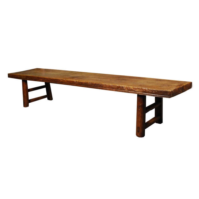 A large three person bench from Northern China. This c. 1850 bench features one solid elmwood plank top.

Pagoda Red Collection # BJC068