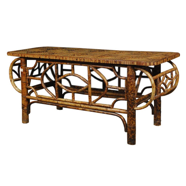A low bamboo table from Southern China. The circa 1900 table features a unique design and a beautiful diamond pattern top.

Pagoda Red Collection # BJC086