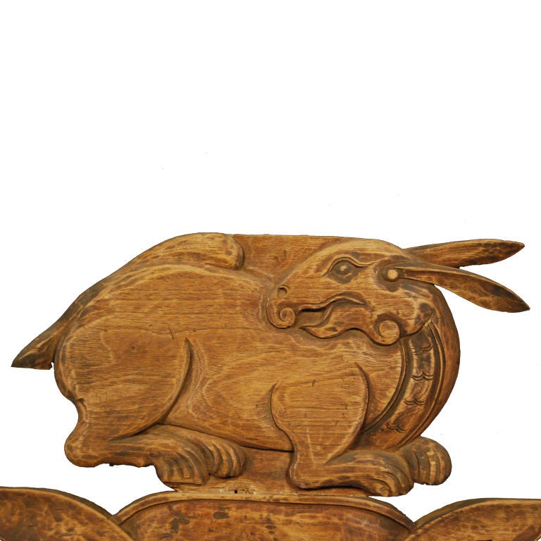 19th century Chinese carved camphor architectural element depicting a rabbit on ruyi clouds.