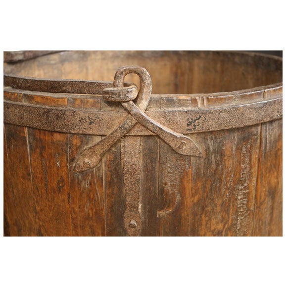 An early 19th century Chinese elmwood bucket of grande proportion, with forged iron handle and strappings.

Pagoda Red Collection #:  Y158

Keywords:  Bucket, planter, basin, garden, pot, basin