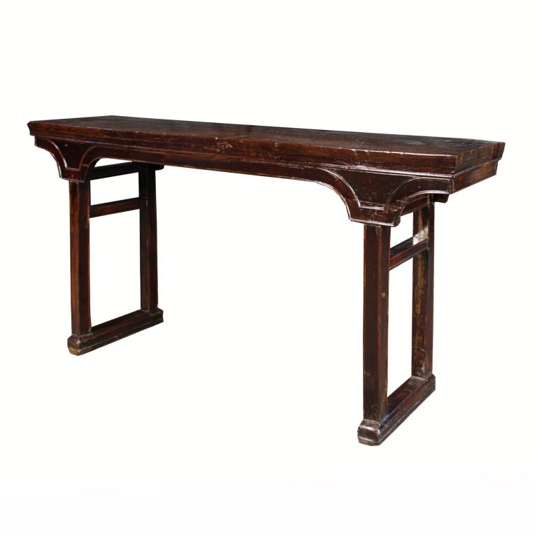 A 19th century Chinese longyen wood altar table with solid plank top and 