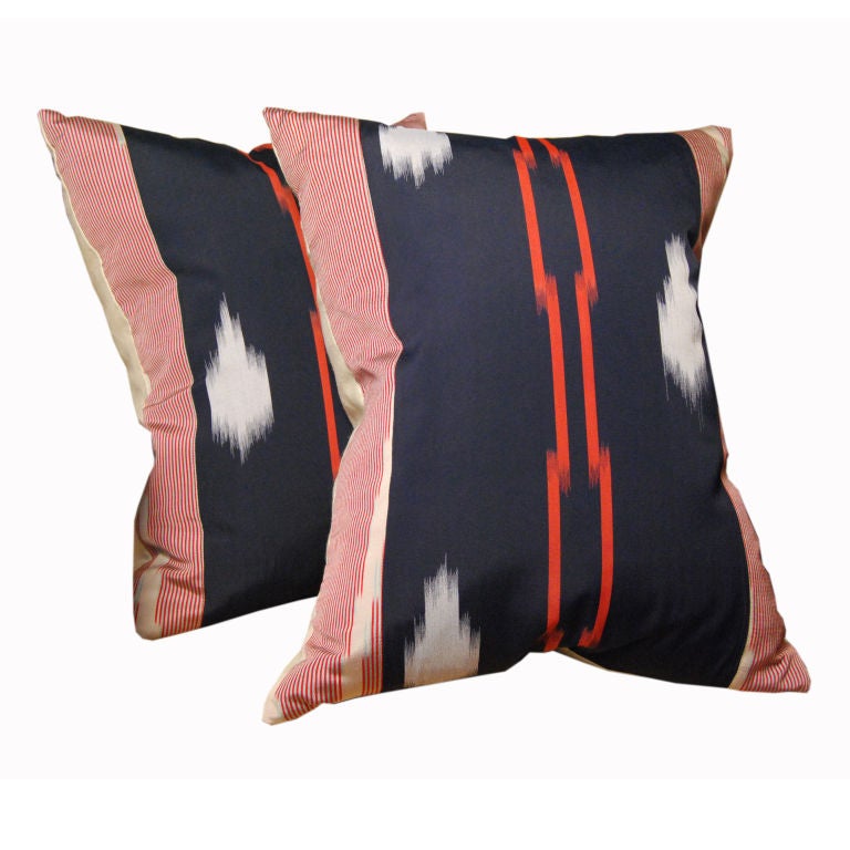 A pair of vintage Japanese silk ikat down-filled pillows.<br />
<br />
Pagoda Red Collection #:  CTXBP3<br />
<br />
<br />
Keywords:  Pillow, textile, tapestry, Japanese, Japan, ikat, woven