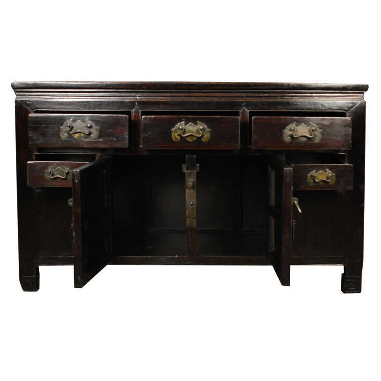 A coffer from Tianjin Province, China made of Chinese Northern Elm. This chest features two doors and five drawers, each with bat shaped hardware.