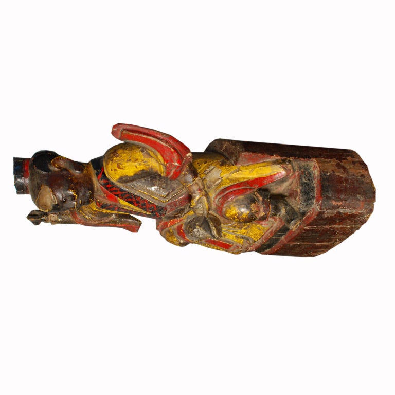 A 19th century Chinese carved elmwood and polychrome altar spirit from Northern China.