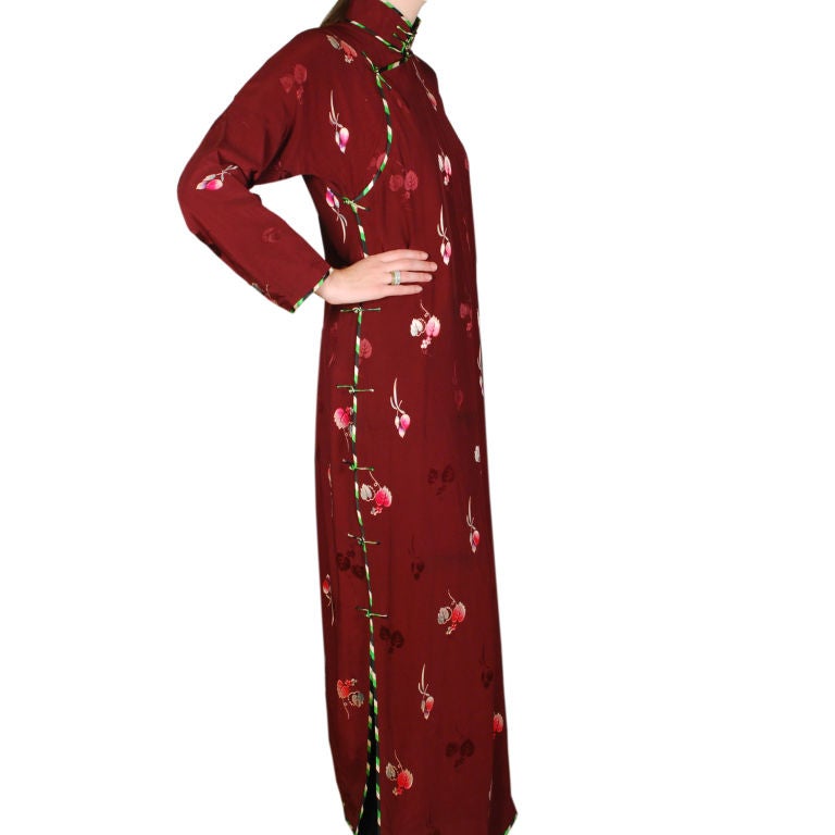 A vintage early 20th century Chinese silk qipao dress with woven leaf pattern on a dark cherry field.  Size:  small<br />
<br />
Pagoda Red Collection #:  MM389A<br />
<br />
<br />
Keywords:  Dress, vintage, dress, garment, silk, China