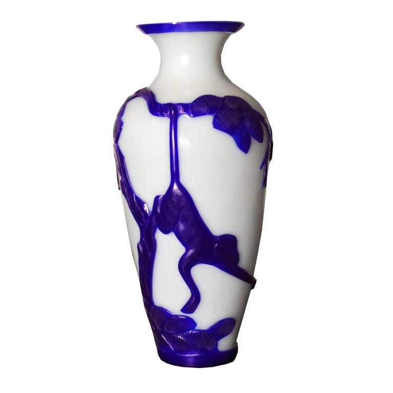 A 19th Century Chinese blue and white peking glass vase depicting a spider monkey hanging from a pine tree.<br />
<br />
Pagoda Red Collection #:  CHC002<br />
<br />
<br />
Keywords:  Vase, urn, vessel
