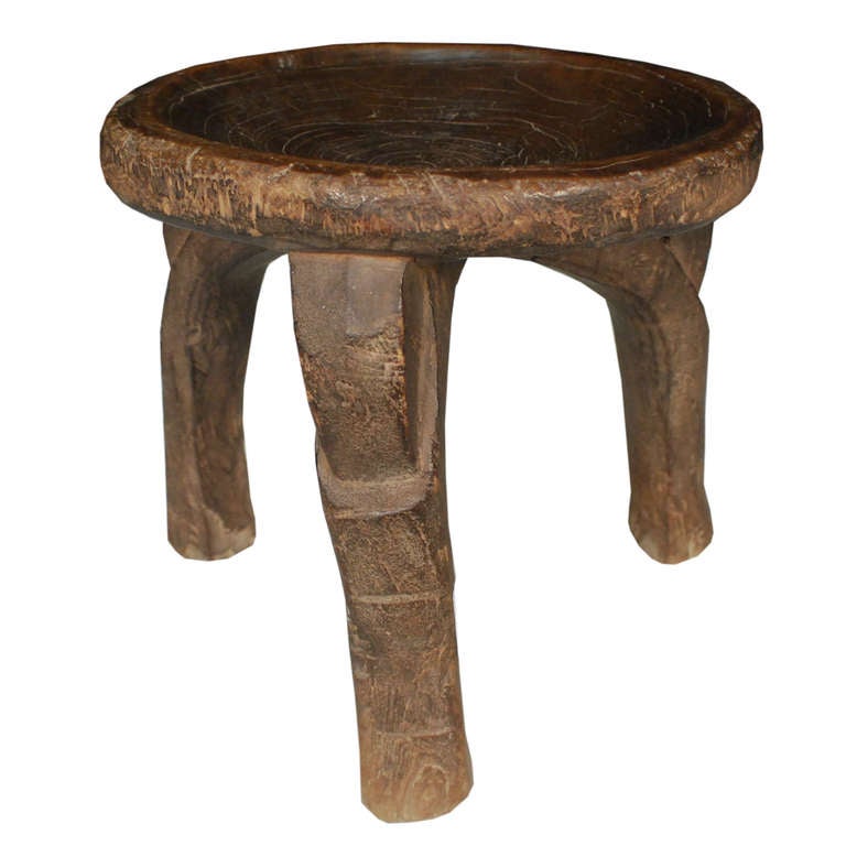 A unique petite stool from Tanzania. This three-legged circa 1850 walnut stool is made from the very core or 
